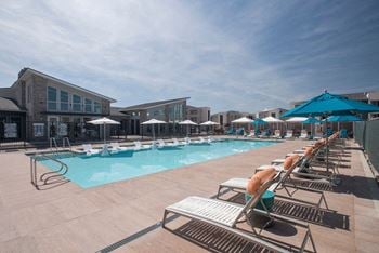 Community swimming pool with lounge chairs
